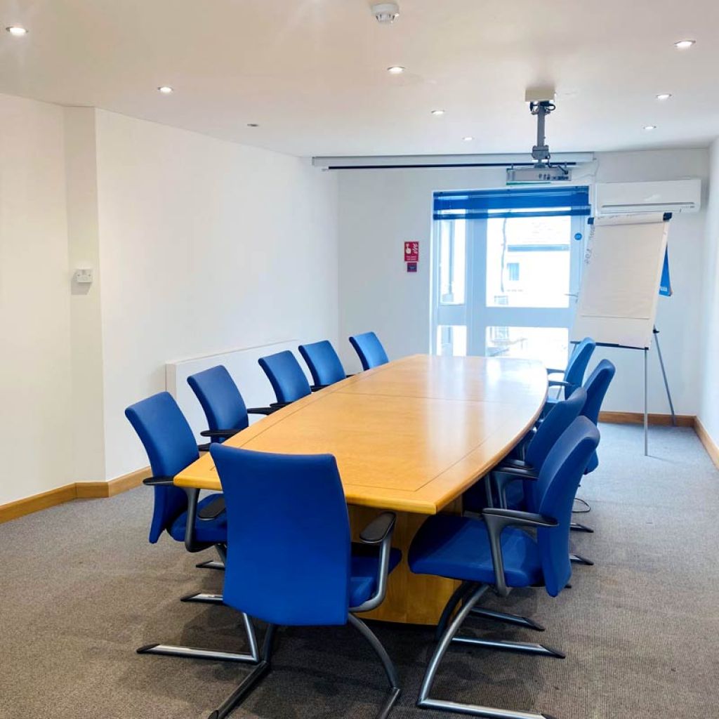 Conference Room, with long table and blue chairs
